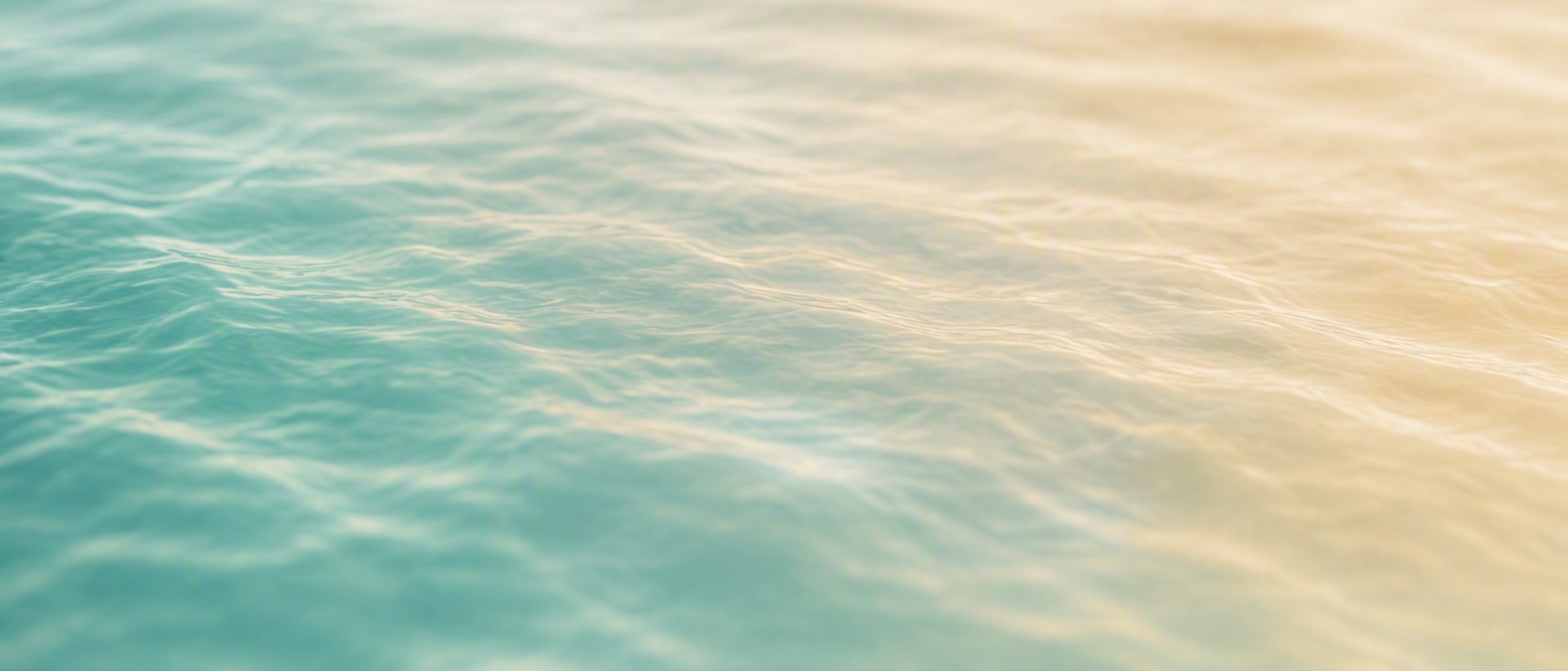 Calm water surface representing a considered, reassuring approach to care